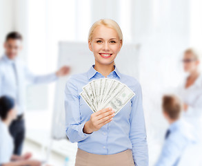 Image showing young businesswoman with dollar cash money