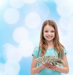 Image showing smiling little girl with dollar cash money