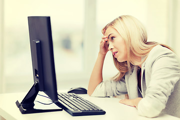 Image showing stressed woman with computer