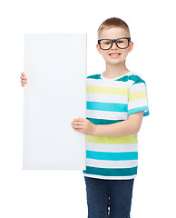 Image showing smiling boy in eyeglasses with white blank board