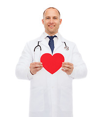 Image showing smiling male doctor with red heart