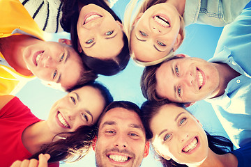 Image showing group of teenagers looking down