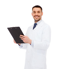 Image showing smiling male doctor with clipboard