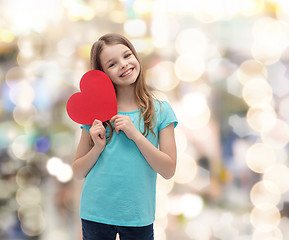 Image showing smiling little girl with red heart