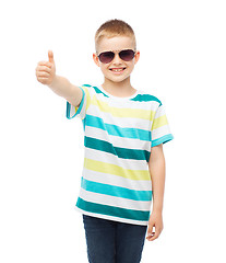 Image showing smiling little boy in sunglasses showing thumbs up