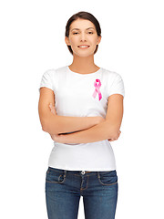 Image showing smiling woman with pink cancer awareness ribbon