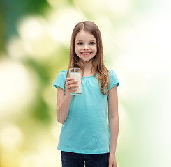 Image showing smiling little girl with glass of milk