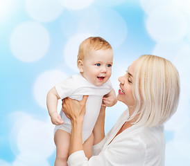 Image showing happy mother with smiling baby