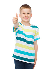 Image showing little boy in casual clothes showing thumbs up