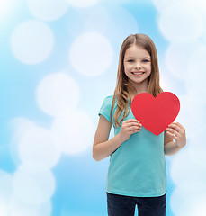 Image showing smiling little girl with red heart