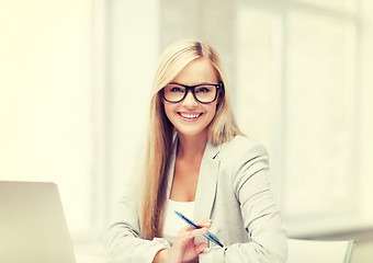 Image showing businesswoman with pen