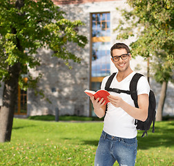 Image showing travelling student with backpack and book