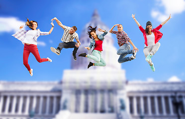 Image showing group of teenagers jumping