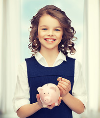 Image showing girl with piggy bank