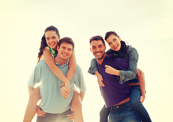 Image showing group of smiling people having fun on the beach