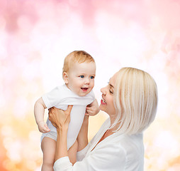 Image showing happy mother with smiling baby