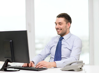 Image showing smiling businessman or student with computer