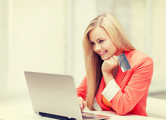 Image showing businesswoman with laptop and credit card