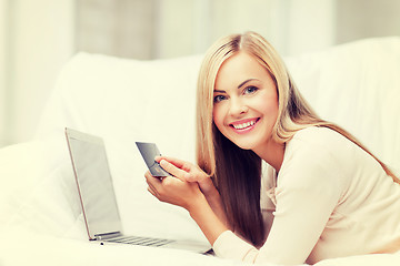 Image showing businesswoman with laptop and credit card