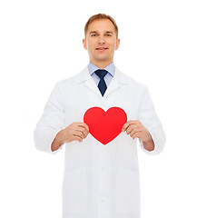 Image showing smiling male doctor with red heart