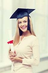 Image showing student in graduation cap with certificate