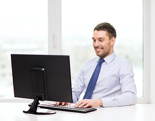 Image showing smiling businessman or student with computer