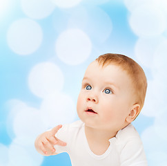 Image showing curious baby looking up