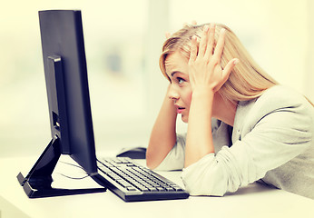 Image showing stressed woman with computer