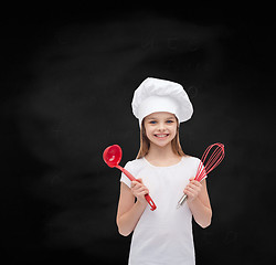 Image showing smiling girl in cook hat with ladle and whisk