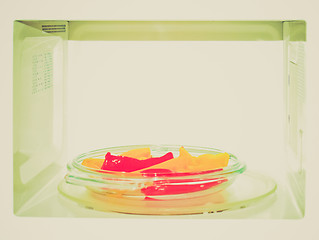 Image showing Retro look Microwave with peppers