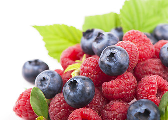 Image showing Many blueberries, raspberries. Isolated white