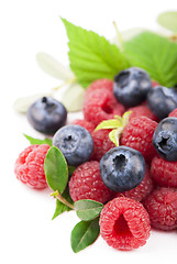 Image showing Many blueberries, raspberries. Isolated white