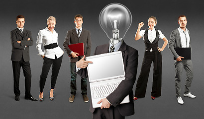 Image showing Business Team With Lamp Head