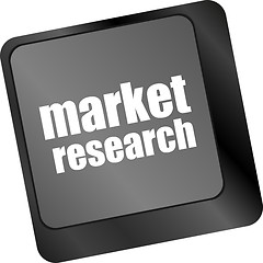 Image showing key with market research text on laptop keyboard, business concept