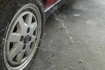 Image showing 80’s tire among cobwebs