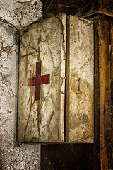 Image showing Old first aid kit among the cobwebs