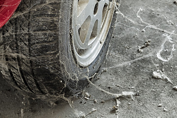 Image showing 80’s tire among cobwebs