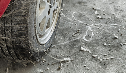 Image showing 80’s tire among cobwebs