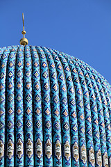 Image showing Tiled dome of a mosque with a golden crescent 