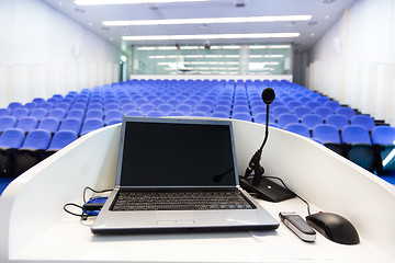 Image showing Laptop on the rostrum in conference hall.