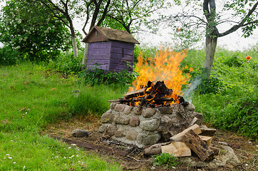 Image showing fireplaces ease burn a pile of dry branches 