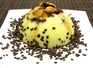 Image showing Custard with sliced banana and grated chocolate