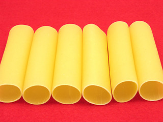 Image showing A close-up view on several canneloni on red felt