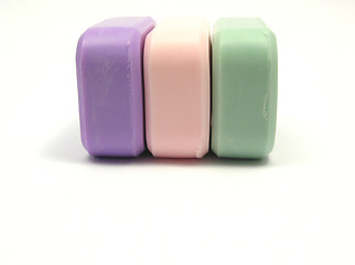 Image showing Three colored soaps on a white background