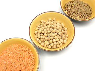 Image showing Three bowls of ceramic with garbanzos lentils and red lentils