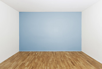 Image showing Empty room with a blue wall