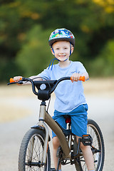 Image showing kid riding bicycle