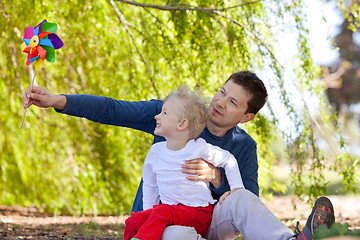 Image showing family with pinwheel