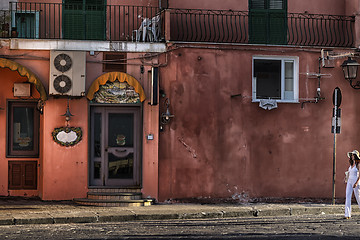 Image showing White dressed lady at the sunset in Ischia