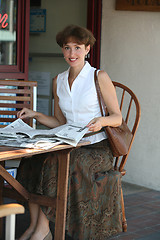 Image showing Woman with newspaper